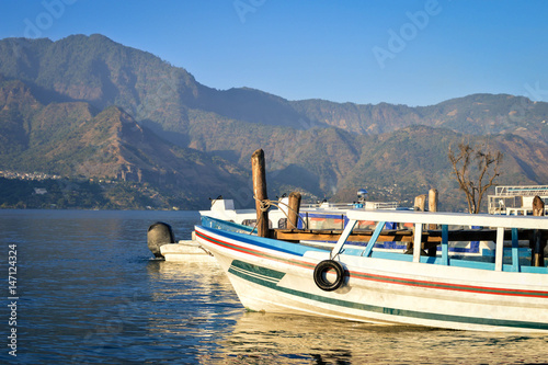 Boats at Pana dock berth in Lake Atitlan, Solola department, Guatemala photo
