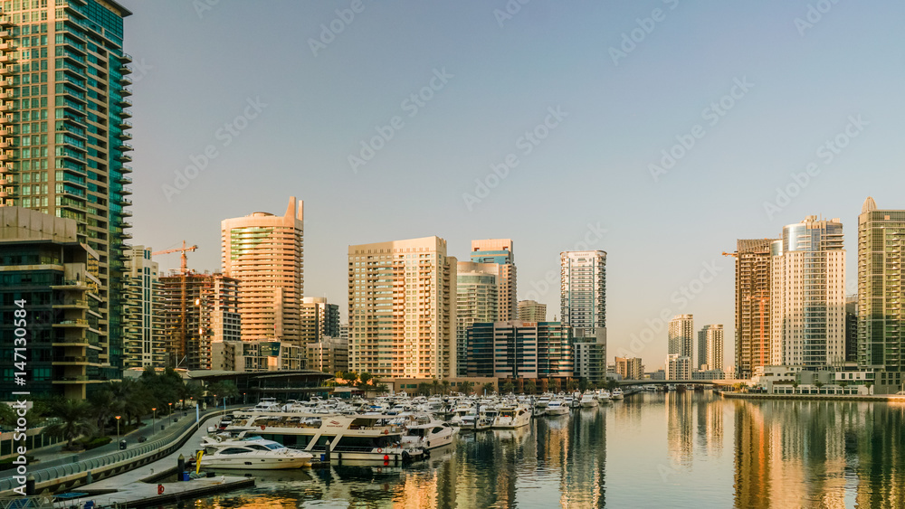 Fototapeta premium Dubai. In the summer of 2016. Construction of modern skyscrapers in Dubai Marina on the shore of the Arabian Gulf. 
