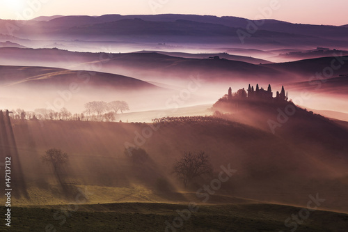 sunlight on foggy hills of Orcia valley, Tuscany