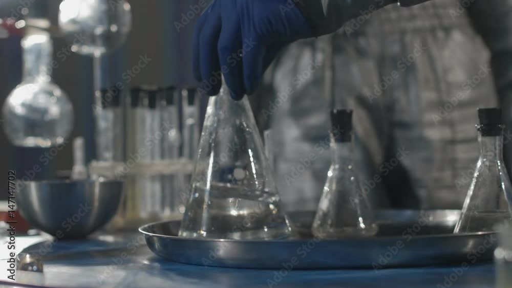 The scientist and his assistant conduct chemical experiments in an underground laboratory in Slow motion The scientist and his assistant conduct chemical experiments in an underground laboratory in Slow motion