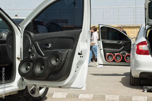 car with a large number of installed audio speakers and subwoofer