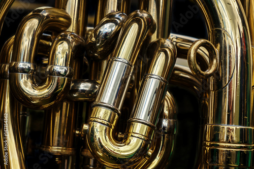 Detail of the brass pipes of a tuba photo
