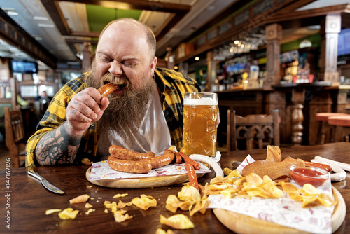Man eating in a restaurant photo