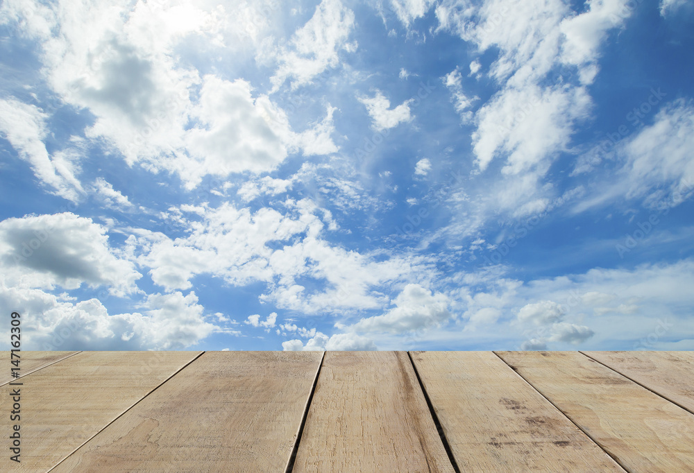 wooden plank with wooden plank with panorama shot of blue sky and clouds wooden plank with wooden plank with panorama shot of blue sky and clouds