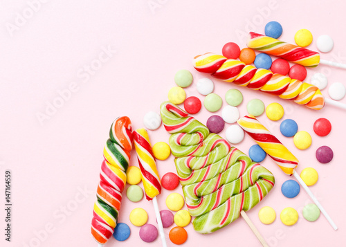 Lollipops sweets. Candy, top view flat lay on pink background. Sweet sucker, lollipop, candy, isolated minimal concept above decoration, food background