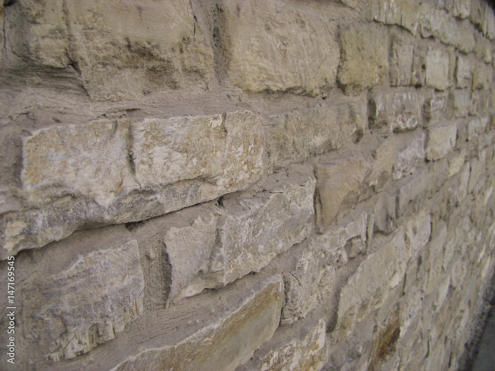 Pattern gray color of modern style. Antique natural stonewall. Stone wall surface with cement. Stones or blocks