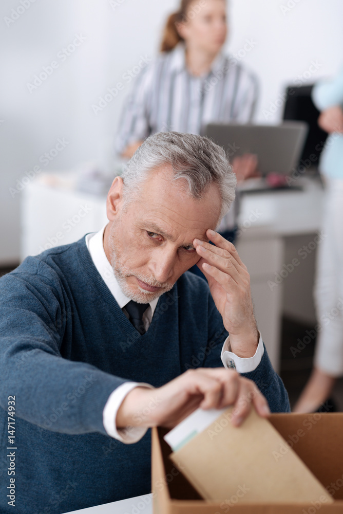 Fototapeta premium Man in years looking very sad