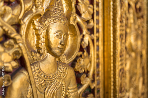 Beautiful golden carving on the door of Wat Sensoukharam temple in Luang Prabang, Laos © Mazur Travel