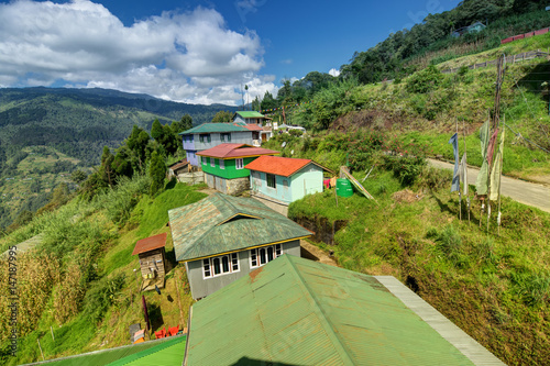 Okhrey village, Himalayan mountains in background, in Sikkim, India. photo