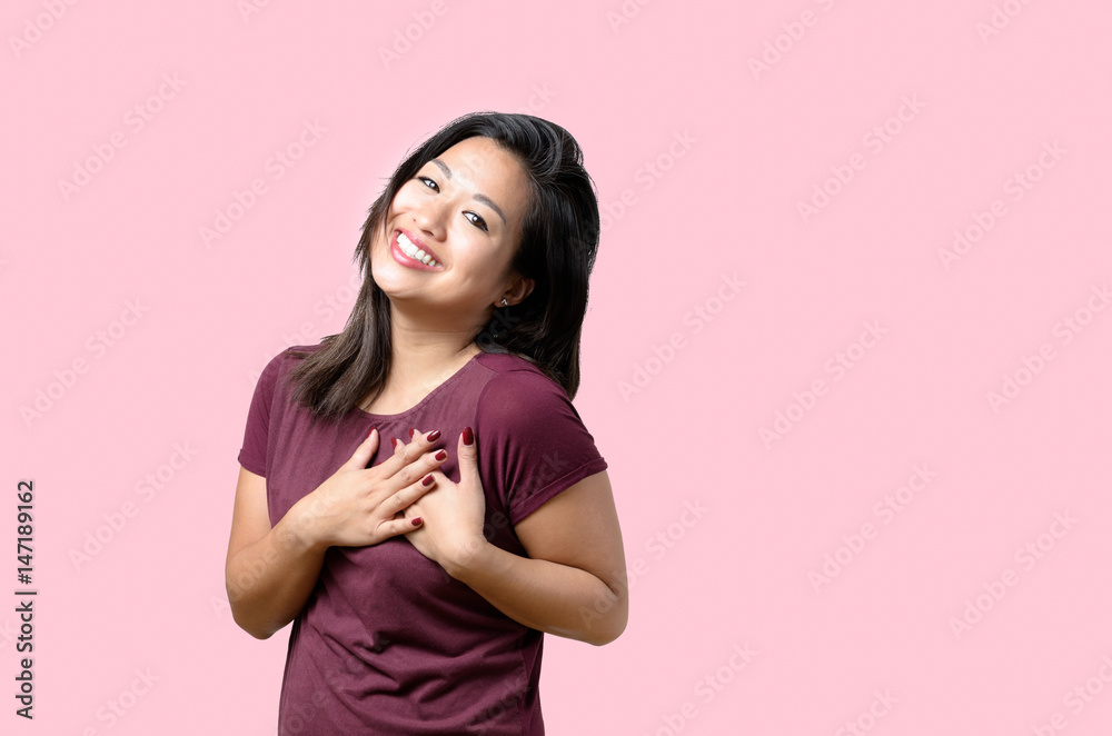 Young woman showing her heartfelt gratitude Young woman showing her heartfelt gratitude