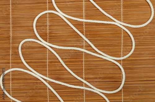 Zigzag from a rope, on a wooden background