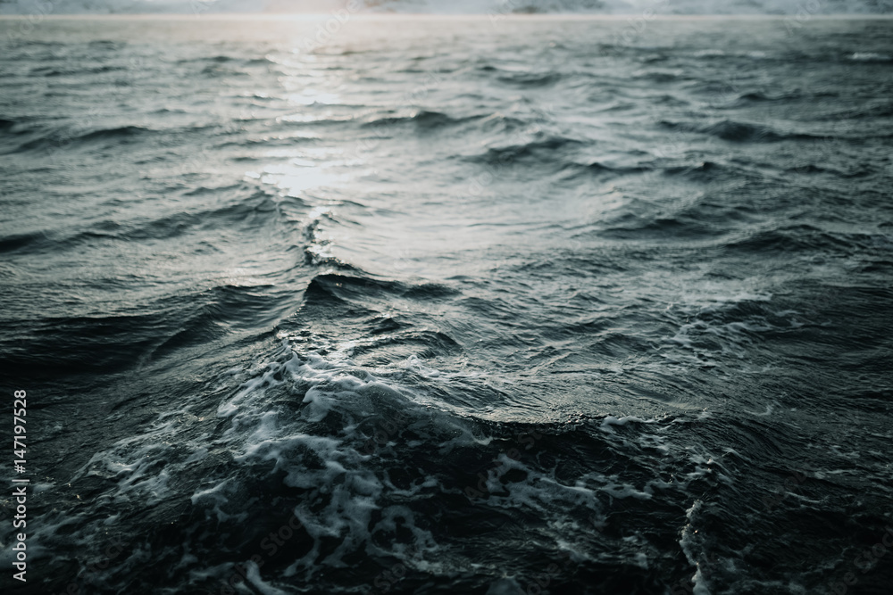 Abstract water texture background. Sun reflected on water