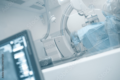Patient On the table in X-ray operating room (Cath lab) photo