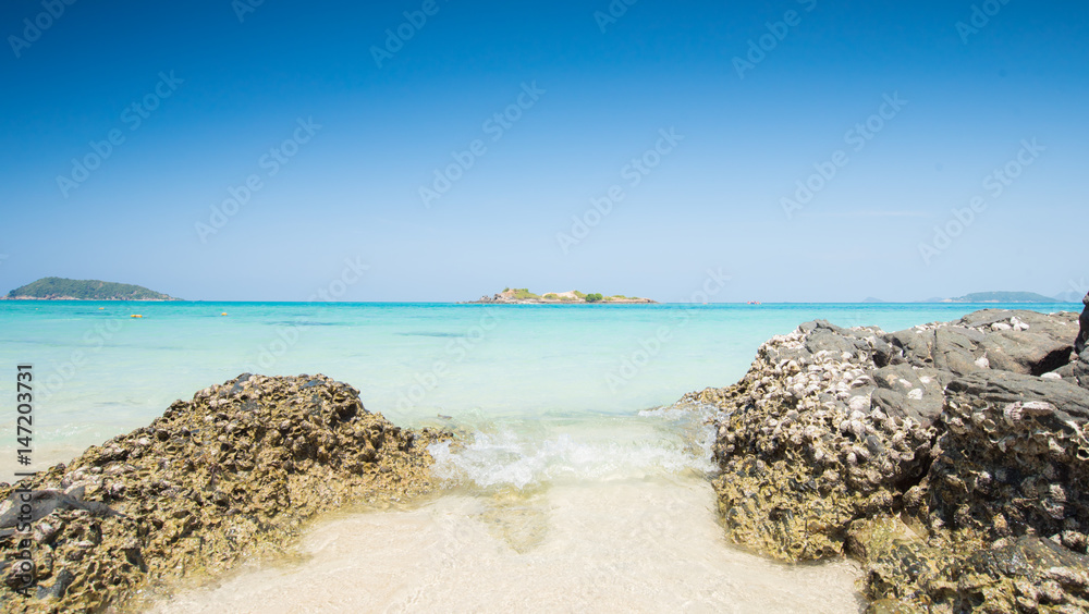 Stone on Sea beach blue sky sand sun daylight relaxation at samaesarn island, Thailand.