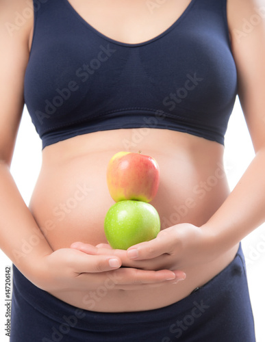Pregnant woman holding green and red apple on isolate white background,Healthy Food Concept