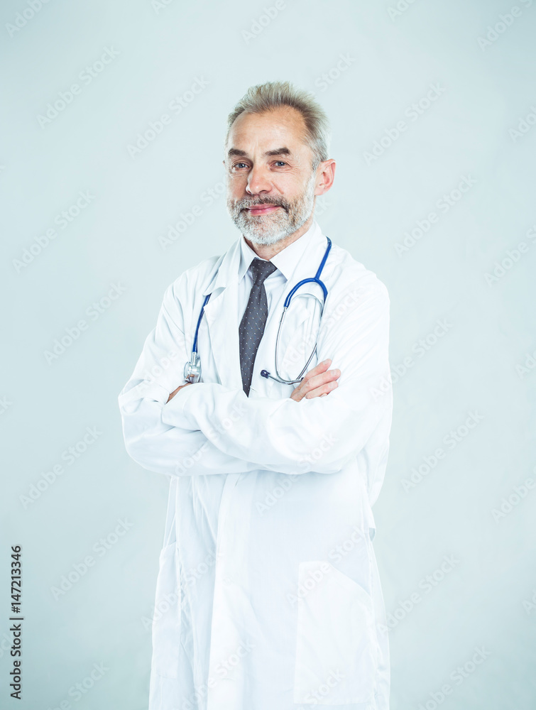 experienced therapist with a stethoscope on light background. experienced therapist with a stethoscope on light background.