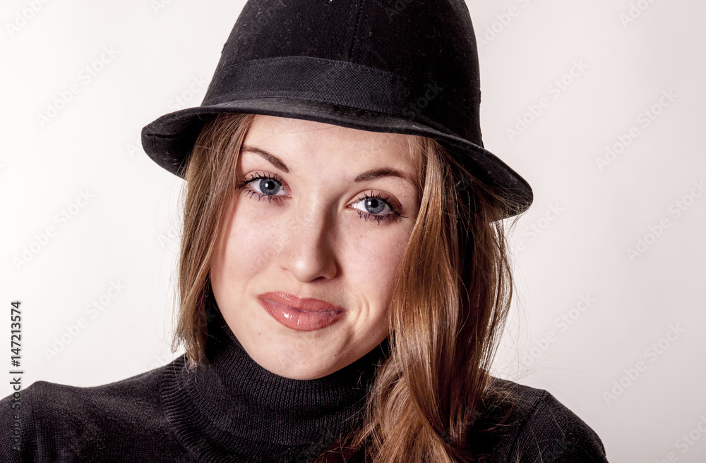 Portrait of a beautiful girl with long hair in a hat
Portrait of a beautiful girl with long hair in a hat
