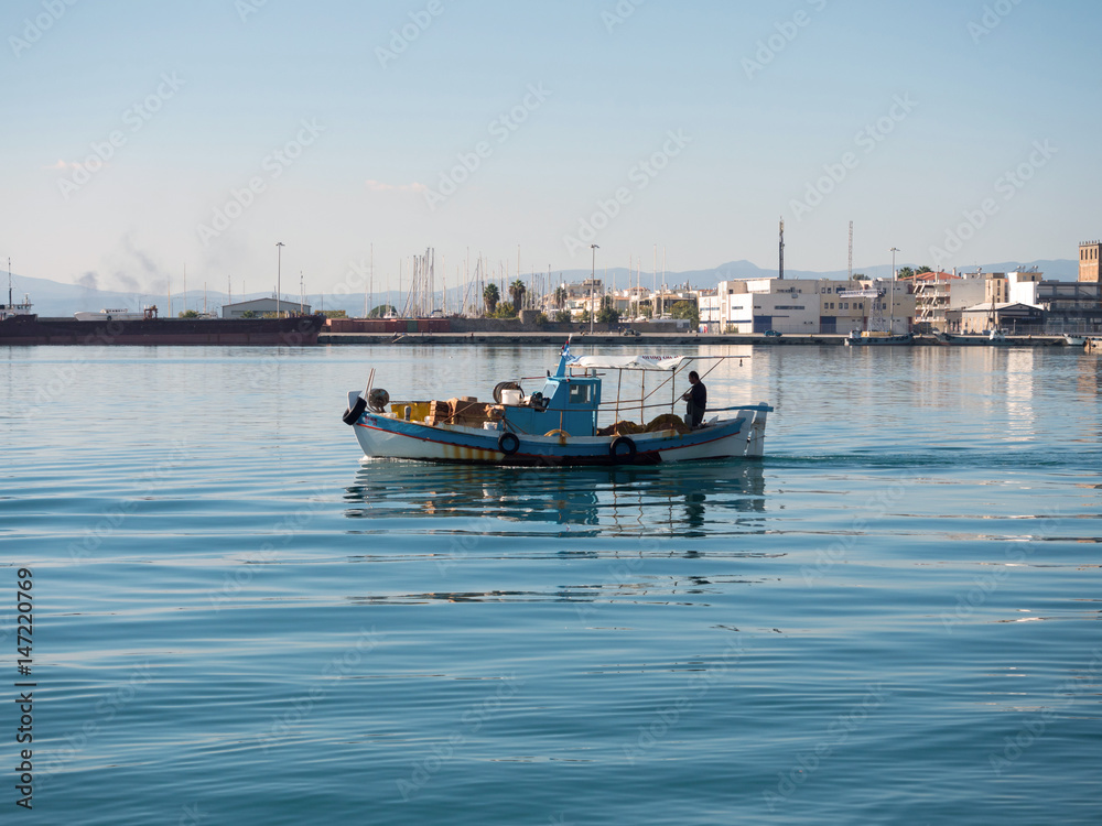 Fishing boat leaving the port