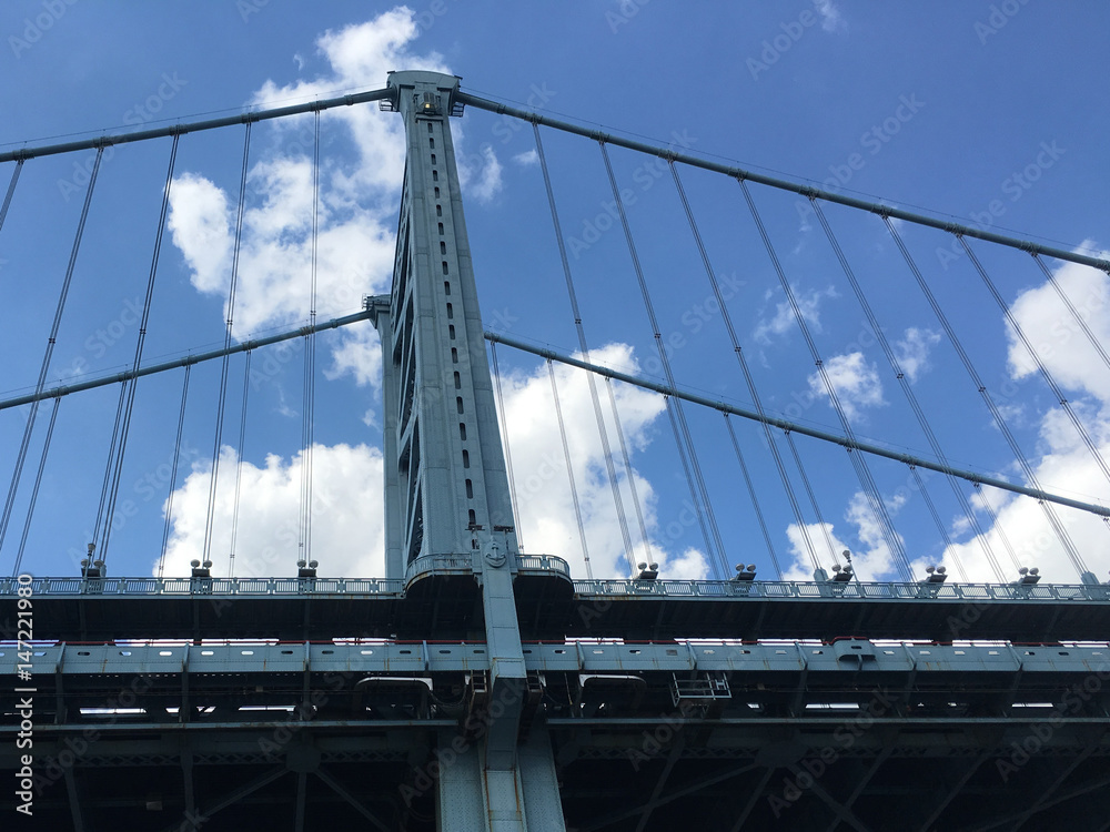 Fototapeta premium Bridge with Blue Sky and White Clouds in Background