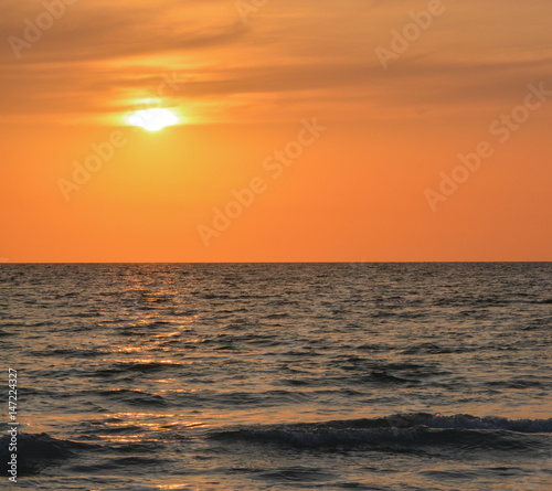 A beautiful sunset over the Gulf of Mexico on Indian Rocks Beach, Florida.