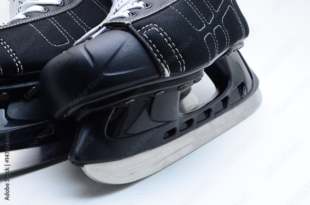 Fototapeta premium black hockey skates closeup on white background