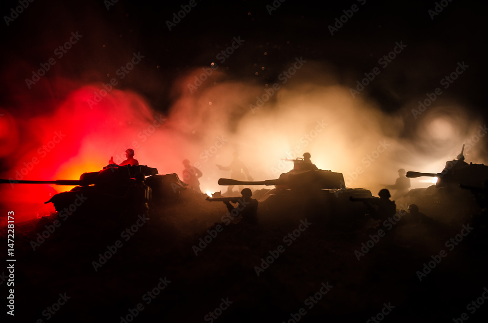 War Concept. Military silhouettes fighting scene on war fog sky background, World War Soldiers Silhouettes Below Cloudy Skyline At night. Attack scene. Armored vehicles.