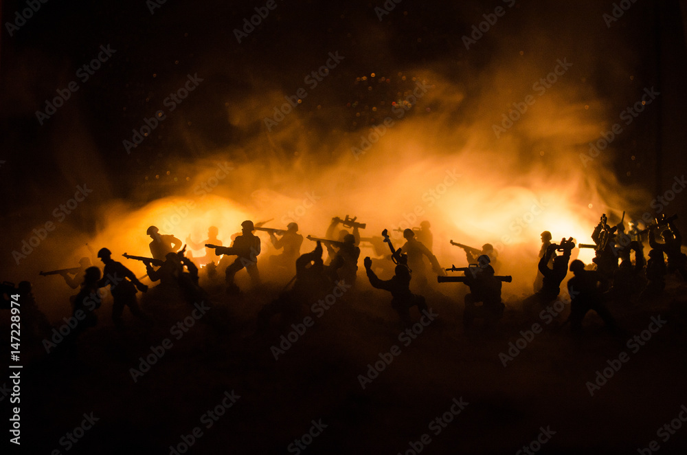 War Concept. Military silhouettes fighting scene on war fog sky background, World War Soldiers Silhouettes Below Cloudy Skyline At night. Attack scene. Armored vehicles. War Concept. Military silhouettes fighting scene on war fog sky background, World War Soldiers Silhouettes Below Cloudy Skyline At night. Attack scene. Armored vehicles.