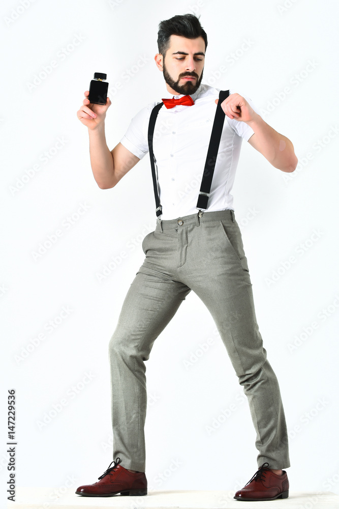 Bearded man, caucasian hipster with moustache and perfume bottle
