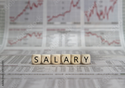 Salary word built with letter cubes