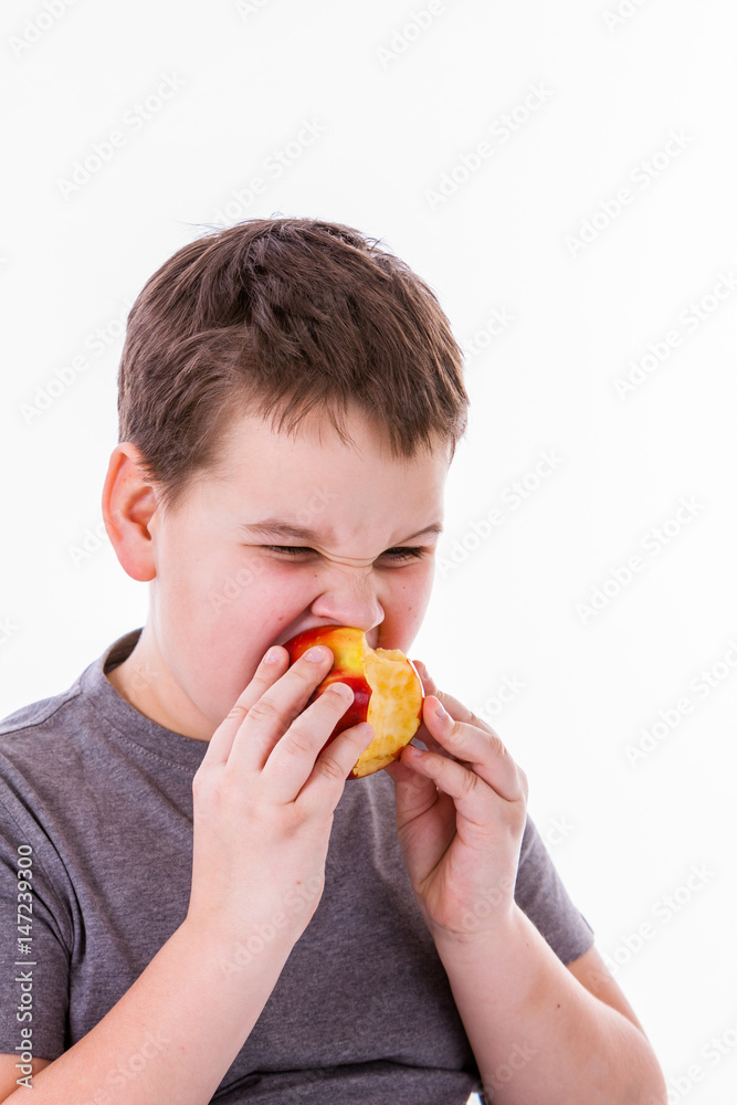 little boy with food isolated on white background - apple or a muffin little boy with food isolated on white background - apple or a muffin