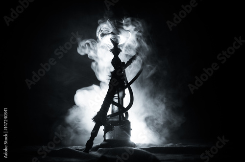 Hookah hot coals on shisha bowl with black background. Stylish oriental shisha photo