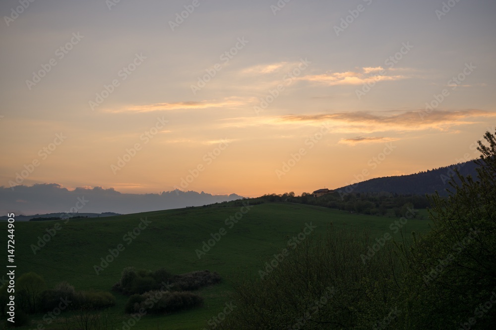 Sunset on meadow with hills and tree. Slovakia Sunset on meadow with hills and tree. Slovakia
