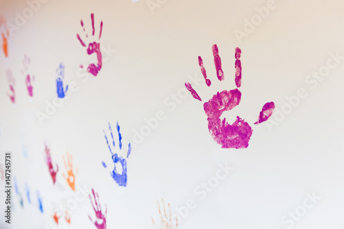imprint of a child's hand on the wall. The concept of friendship and the background in a children's gym.