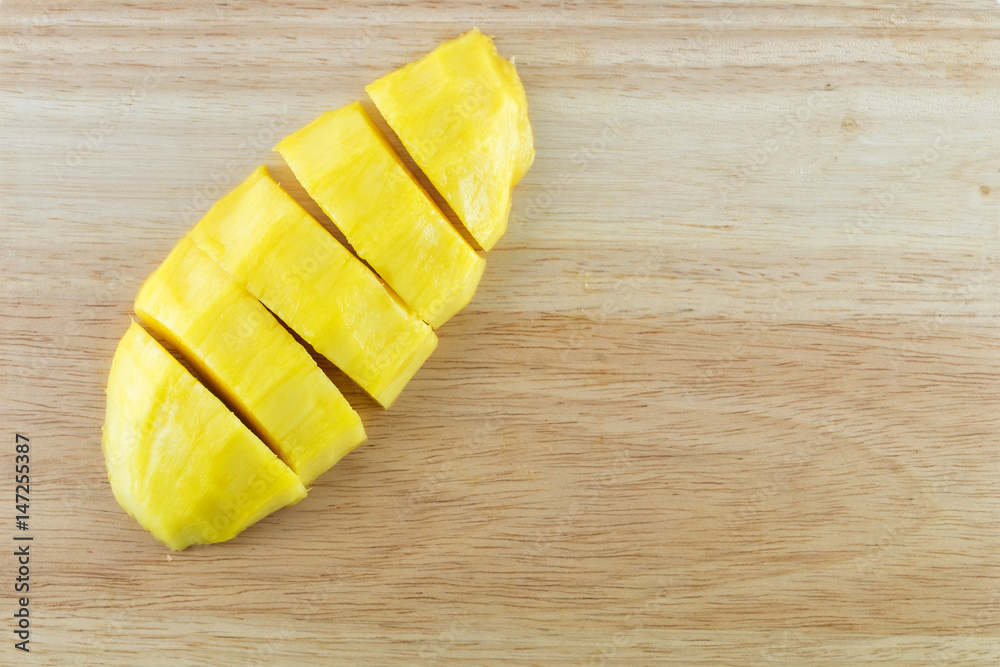 Close-up view Mango on wood background. Close-up view Mango on wood background.