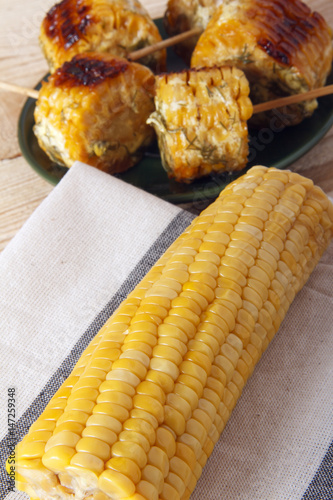 Corn cobs cooked on a grill