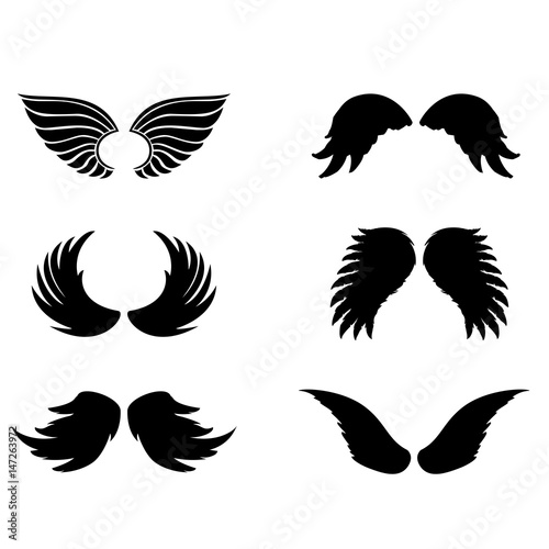 Silhouette of black angel wings and halo on a white background. Vector feathers silhouette design element.