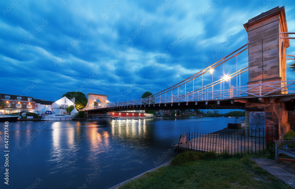 Naklejka premium Twilight capture of the Marlow suspension bridge over the River Thames at Marlow in Buckinghamshire
