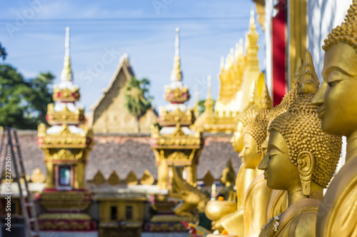 The row of gold Buddha statues in That Luang temple in the centre of Vientiane  Laos