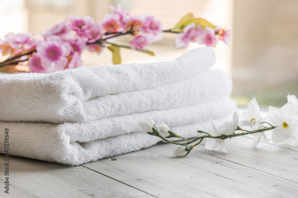 Beautiful spa composition on wooden table with flowers Beautiful spa composition on wooden table with flowers