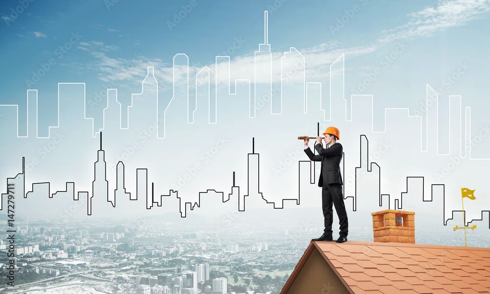 Engineer man standing on roof and looking in spyglass. Mixed media Engineer man standing on roof and looking in spyglass. Mixed media