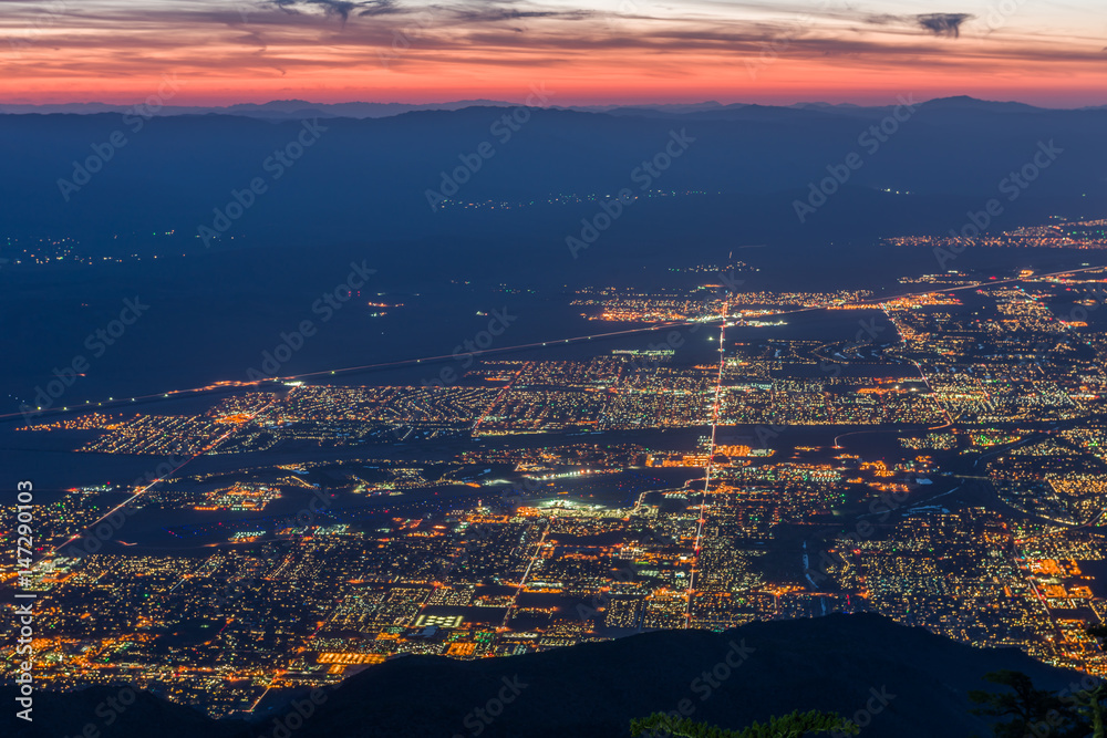 Sunrise over Palm Springs, California with web of street lights -2
