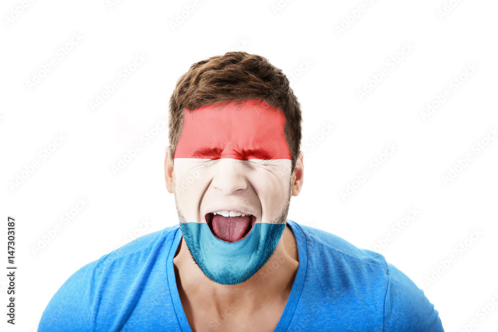Screaming man with Luksemburg flag on face. Screaming man with Luksemburg flag on face.