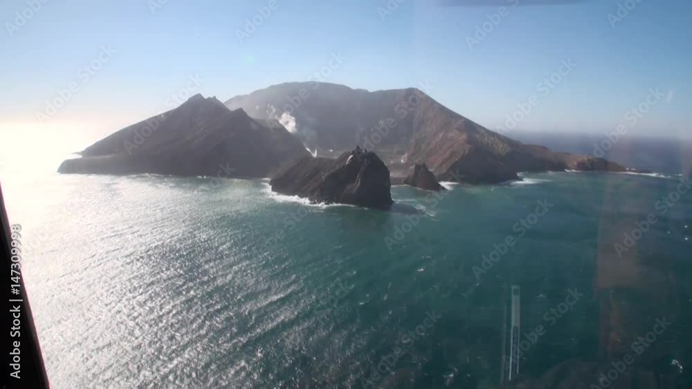 White island and volcano panorama view from helicopter window in New Zealand. Scenic peaks and ridges. Beautiful background of amazing nature. Travel and tourism in the world of wildlife. White island and volcano panorama view from helicopter window in New Zealand. Scenic peaks and ridges. Beautiful background of amazing nature. Travel and tourism in the world of wildlife.