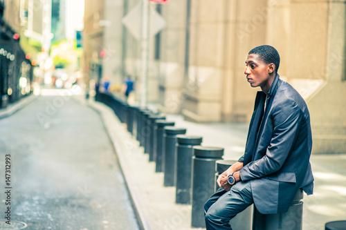 Young African American Man thinking outside on street in New York