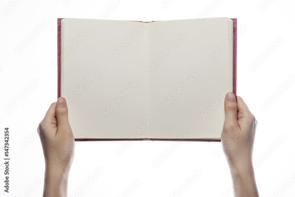 Obraz premium woman hand hold a red book isolated white.