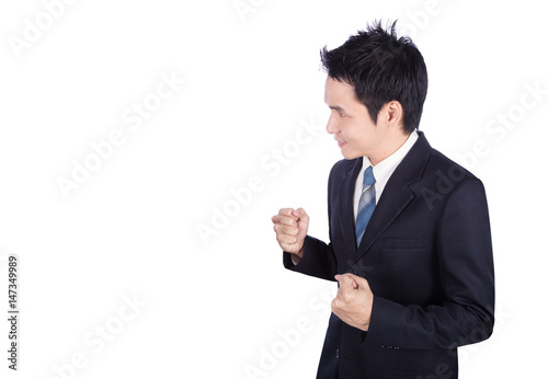 Successful business man with arm raised isolated on white