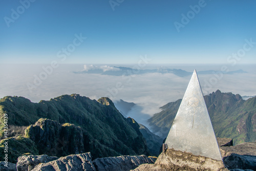 Beautiful peak of the mountain over the clouds - Fansipan Mountain in Vietnam photo