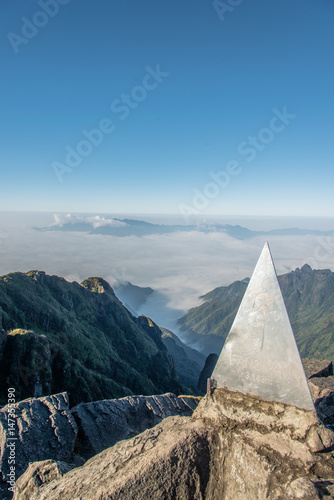 Beautiful peak of the mountain over the clouds - Fansipan Mountain in Vietnam