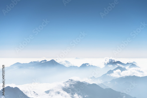 Beautiful mountain ridge in the clouds - Fansipan Mountain in Vietnam photo