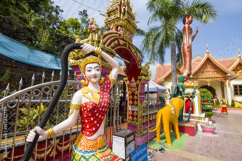 Colorful statue of Phra Mae Thorani - chthonic goddess from Buddhist mythology in Southeast Asia, located in Wat Si Muang Buddhist temple in Vientiane, Laos